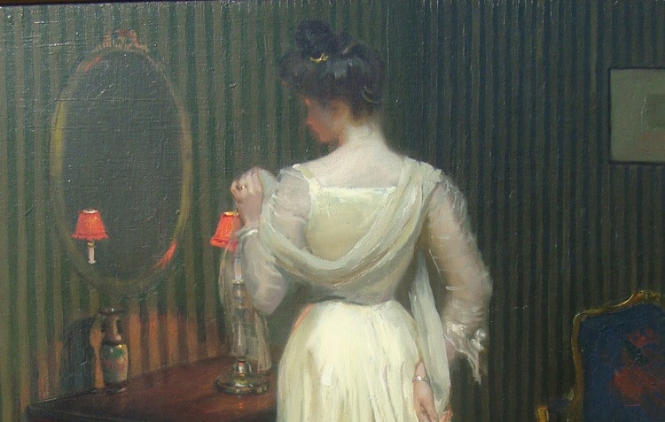 Charles Bittinger's Before the Mirror. Elegant woman dressed for an evening out stands in front of an oval mirror. White, long dress. The room's wall paper is green and white pinstripe.