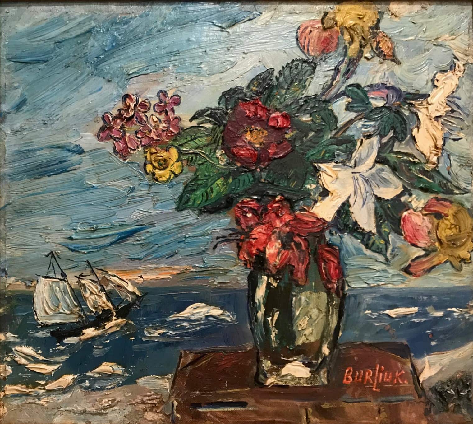 Burliuk's Still Life with Ship and Flowers. Vase of flowers on a table, seaside, with sailing vessel. Thick, textured brushwork.